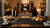 Elegant autumn table setting with small pumpkins, gourds, candles, and fall foliage arranged on dark runner for seasonal holiday dining and entertaining.
