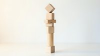 Wooden building blocks tower balancing precariously on white background, showcasing instability and risk management concepts for business presentations.