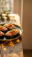 Festive salmon canapes with cream cheese and dill on dark bread served on elegant plate during Christmas celebration with warm bokeh lights creating cozy atmosphere.