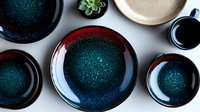 Elegant ceramic dinnerware set with deep teal and burgundy glazed finish, modern tableware collection for sophisticated dining and kitchen styling.