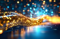 Golden sparkling wave flows across blue surface with bokeh lights creating magical particle stream effect for luxury backgrounds and digital art projects.