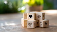 Wooden dice with heart and brain symbols on rustic table surface against blurred green background, representing balance between emotions and logic.