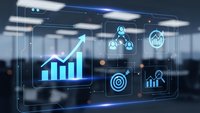 Futuristic holographic business analytics dashboard with glowing charts and data visualization icons floating in modern office environment.