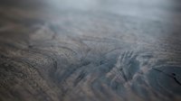 Aerial view of desert landscape with intricate erosion patterns and ridged terrain formations, suitable for environmental, geological, and travel design projects.