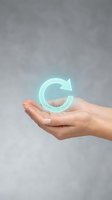 Hand holding glowing green recycling arrow symbol representing sustainability and environmental responsibility for eco-friendly business concepts.