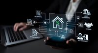 Smart home automation technology concept with digital icons floating above hands on laptop keyboard for modern living solutions.