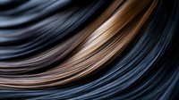 Abstract flowing waves in dark blue and copper tones create dynamic motion blur effect for modern digital backgrounds and contemporary design projects.