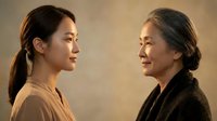 Asian grandmother and granddaughter sharing intimate moment, multi-generational family bonding, elderly woman with gray hair and young adult female connection.