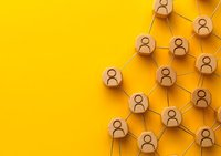Connected wooden circles with user icons forming network structure on vibrant yellow background, representing social connections and community growth patterns.