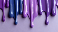 Colorful dripping paint in purple and blue shades creating abstract pattern on light background. Glossy liquid drops flowing down for creative design projects.