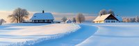 Winter landscape with snow-covered houses and winding path through pristine white field under clear blue sky, perfect for holiday and seasonal designs.