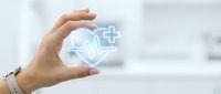 Caucasian hand holding glowing heartbeat and medical cross symbol, representing healthcare, wellness, and digital medicine services for hospital and clinic applications.