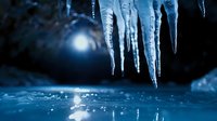 Sharp icicles hanging over frozen water surface with bright light reflection creating dramatic winter scene for seasonal designs and cold weather concepts.