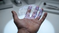 Futuristic holographic brain projection floating above open palm in modern medical laboratory setting showcasing advanced neuroscience technology and innovation.