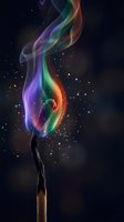Colorful rainbow smoke rising from wooden match against starry night sky background creating magical atmospheric effect for creative projects.