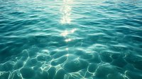 Sunlight sparkles on rippling turquoise ocean water surface creating mesmerizing light patterns and reflections, peaceful serene aquatic background for nature designs.