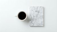 Cup of black coffee and marble notebook on white background, flat lay composition for business, creative workspace, and office design projects.