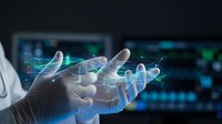 Professional hands holding holographic data visualization with glowing network connections and digital analytics displays on computer screens background.