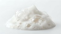White foam bubbles texture isolated on clean background for skincare cosmetics and cleaning product design applications.