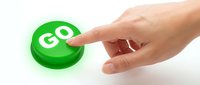 Hand pressing green go button on white background, ready for web design, app interfaces, and call-to-action graphics.