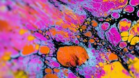 Vibrant abstract fluid art with neon pink, orange and yellow paint splatters on black background creates dynamic cosmic pattern for modern wall decor and creative designs.