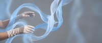 Ethereal blue fabric flowing gracefully around elegant female hands with golden jewelry against soft neutral background for luxury fashion concepts.