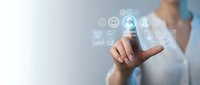 Businesswoman in light blue shirt touching digital interface with glowing icons including smiley face, charts, and user profile symbols representing customer satisfaction and data analytics.