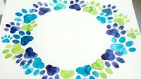 Colorful watercolor paw prints arranged in circular frame on white background. Pet memorial, veterinary clinic decor, animal lover artwork concept.