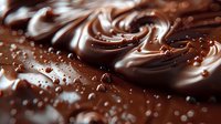 Swirling dark and milk chocolate mixture with splashes and drops creating luxurious marble texture, macro shot with selective focus for dessert designs.