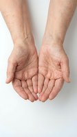 Elderly hands cupped together in giving gesture showing wrinkled skin and age spots on white background for healthcare and aging concepts.