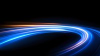 Glowing curved light trails in blue and pink neon colors against black background create dynamic motion effect for technology and speed concepts.