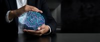 Businessman holding glowing digital brain circuit board, representing artificial intelligence, technology innovation, and future computing solutions for business applications.
