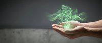 Digital holographic financial growth concept with green money symbols floating above open palm against dark background for business presentations.