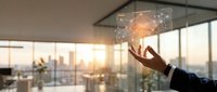 Businessman holding glowing light bulb with cityscape view from office window at sunset, representing innovation, ideas, and business success.