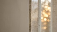 Sheer linen curtain with warm bokeh lights filtering through window, creating soft ambient glow for home decor and interior design projects.