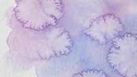 Abstract watercolor background with soft purple and blue gradient washes creating organic flowing shapes for artistic design projects.