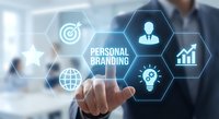 Businessman touching personal branding concept with hexagonal icons including target, growth chart, and lightbulb on virtual screen.