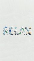 Word RELAX made of colorful sea glass and shells on white sand beach, conveying summer vacation and mindfulness mood.
