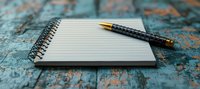 Blank spiral notebook with mechanical pencil on rustic turquoise wooden table. Minimalist composition for writing, journaling and creative inspiration.