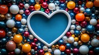 Heart shaped frame surrounded by colorful shiny Christmas baubles and ornaments on blue background, festive holiday decoration for greeting cards and designs.