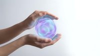 Hands protecting glowing energy sphere with purple and blue light effects for healing wellness and spiritual concepts.