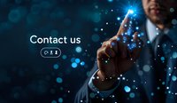 Businessman touching virtual contact button with glowing blue lights and bokeh effect. Modern customer service concept for business communications.