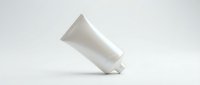 White cosmetic tube container on clean background for skincare product packaging and beauty brand marketing materials.