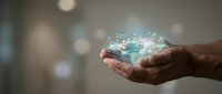 Hands holding glowing digital network connections with futuristic holographic data visualization and light effects for technology concepts.