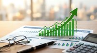 Green growth arrow chart rising above financial reports with calculator and glasses on office desk representing business success and profit increase.