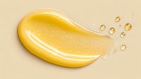 Smooth golden honey or syrup drop with small bubbles on beige background, glossy texture and liquid consistency for food and cosmetic advertising.