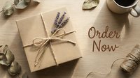 Kraft paper gift box tied with twine and lavender sprig on wooden surface with Order Now text, coffee cup, and eucalyptus leaves.