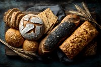 Assortment of freshly baked artisan breads and crackers on rustic wooden board with wheat stalks, showcasing variety of textures and toppings.
