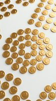 Golden coins with smiley face symbols arranged in heart shape on white background, representing happiness, positivity, wealth and financial success for business concepts.