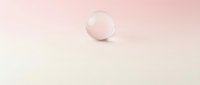 Translucent glass sphere with soft pink gradient on minimalist background, isolated for design projects and digital compositions.